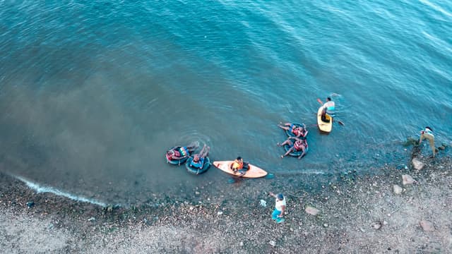 People enjoying Garuga's lakeshore