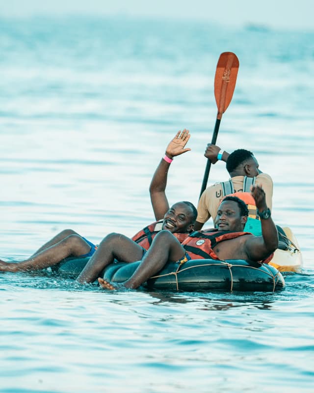 Friends enjoying flat-water tubing on Lake Victoria